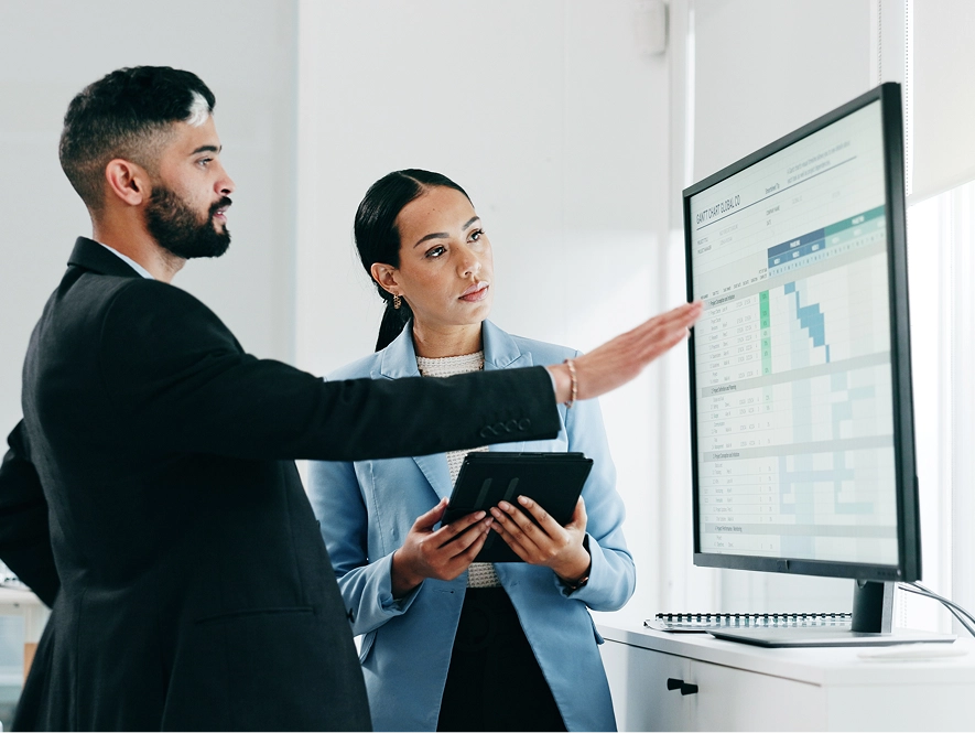 White label advanced ads targeting and audience segmentation — team reviewing performance graph on screen with tablet interaction