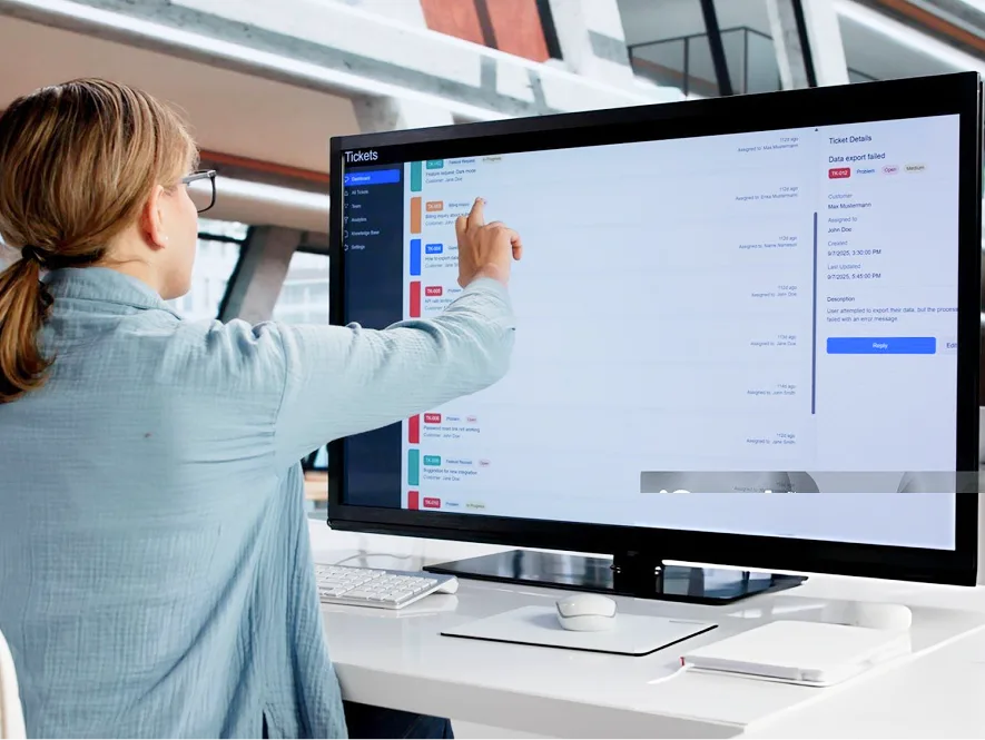 White label Beaver Builder support and maintenance — user interacting with support ticket dashboard on computer screen for website updates and issue tracking