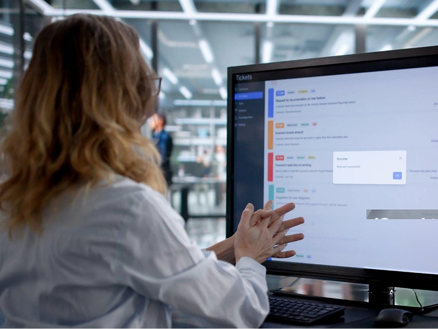 White label Beaver Builder support and maintenance — woman managing website status and support tickets on desktop screen for updates and issue resolution