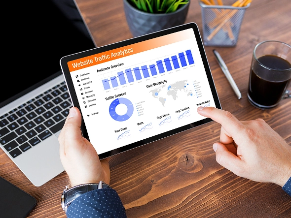 White label BigCommerce store enhancements and optimization — tablet and laptop displaying performance graphs and analytics dashboards for improving ecommerce website speed and conversions