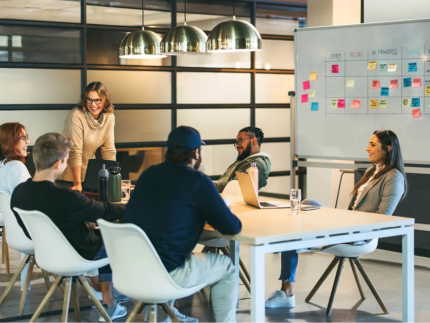 White label content engagement options — team collaborating with planning board and pinned notes representing flexible workflow and content strategies