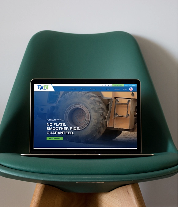 White label custom and industry-specific design — laptop on chair showing industry-focused landing page
