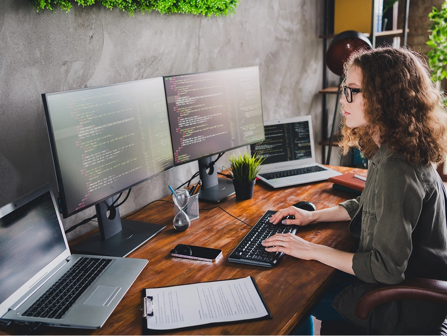 White label Duda custom development and integration — developer working across multiple screens building website features and integrations