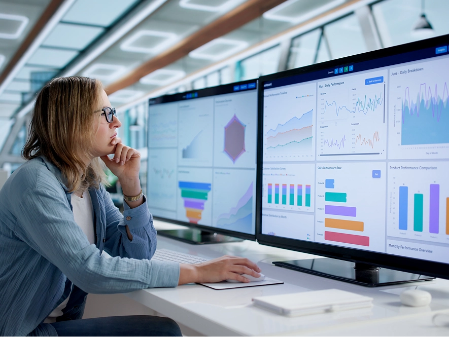 White label Duda website optimization and enhancements — developer analyzing performance graphs across multiple screens for improvement