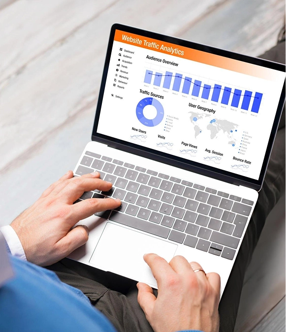 White label ecommerce SEO strategy — laptop in hand displaying performance graph and SEO growth insights