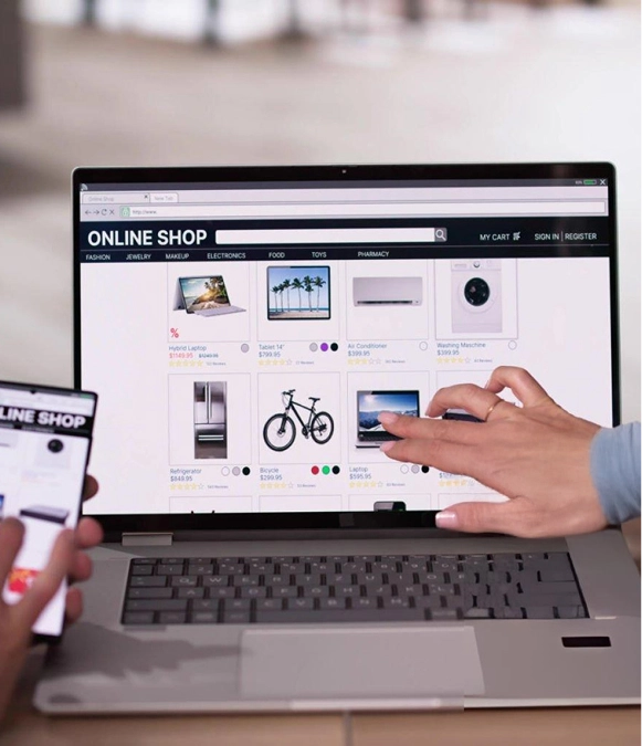 White label ecommerce website design — online shop product page open on laptop with hand pointing interaction