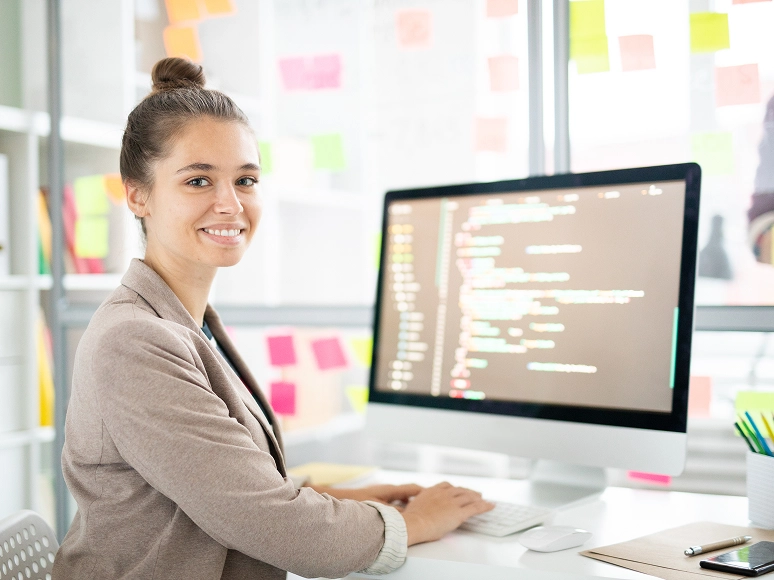 White label Elementor client-friendly website management — woman working on website content and code updates with business tools and integrations