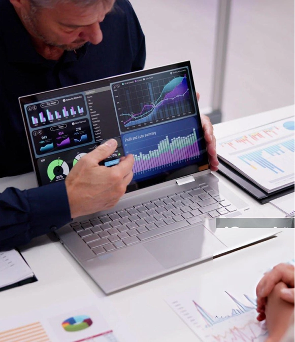 White label GA4 and GTM tracking setup — person presenting analytics graph on laptop for tracking configuration