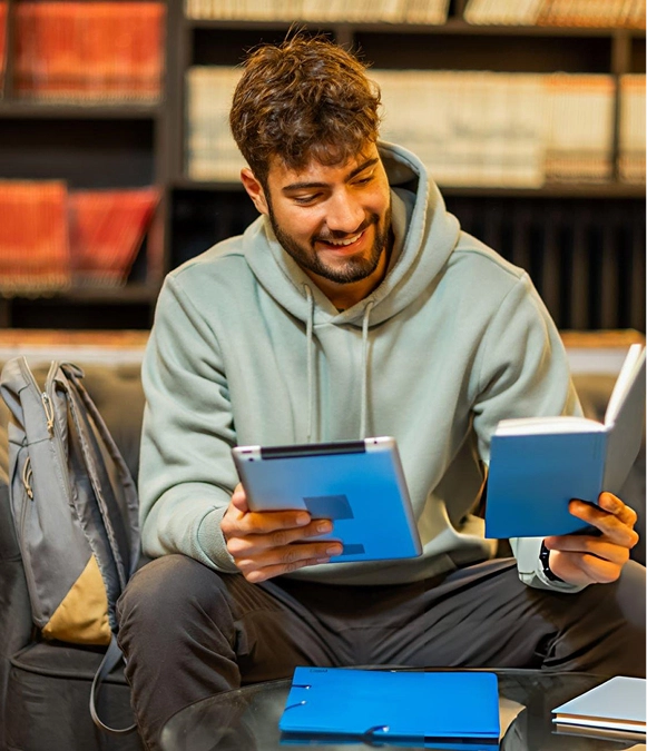 White label keyword research — person holding iPad with diary in hand for planning search terms and strategy