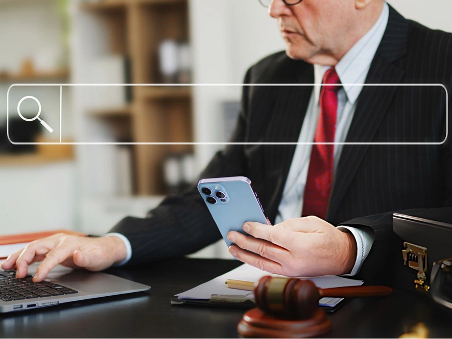 White label local SEO for law firms — professional working on laptop with legal tools like gavel, documents, and briefcase on table to improve search visibility