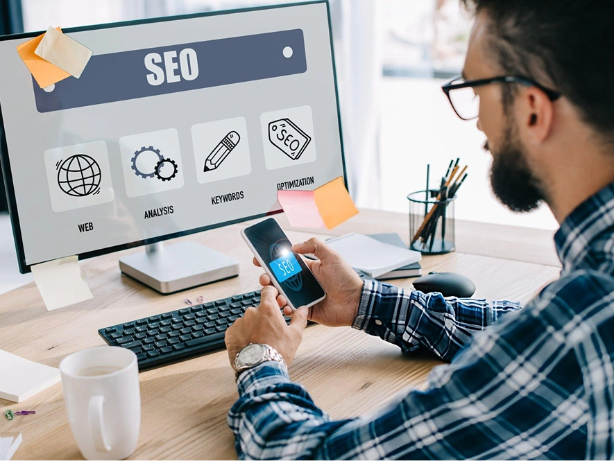 White label local SEO for small businesses — user analyzing SEO dashboards on mobile and desktop showing keywords, analytics, and website performance