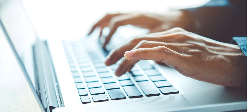 White label marketing and sales copywriting services — professional typing on laptop creating persuasive and high-converting marketing content