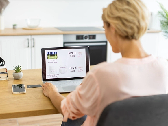 White label Oxygen Builder client-safe design — woman updating website content on laptop with website editor visible on screen