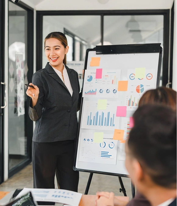 White label strategic content development — professional presenting content performance graphs on large screen during team discussion