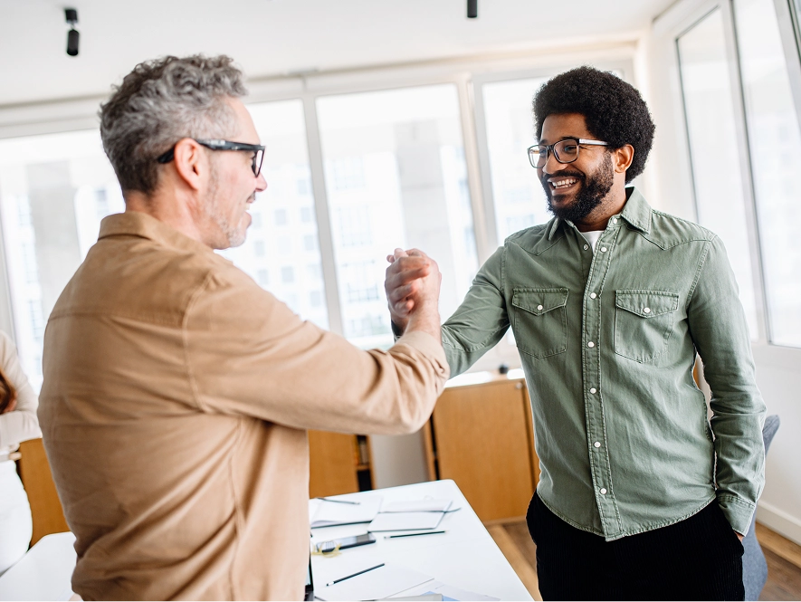 White label trust-building and review strategy — two professionals shaking hands representing client trust and positive reviews