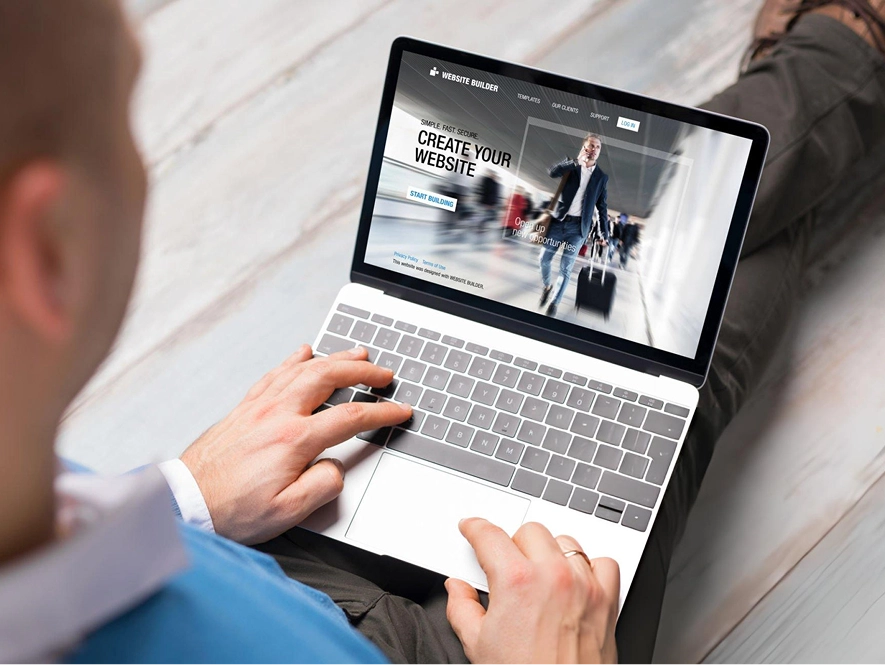 White label Wix advanced customization and flexibility — developer working on laptop with website builder open for custom design and functionality