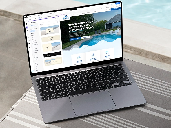 White label Wix custom website development — laptop displaying Wix builder interface for creating tailored website functionality