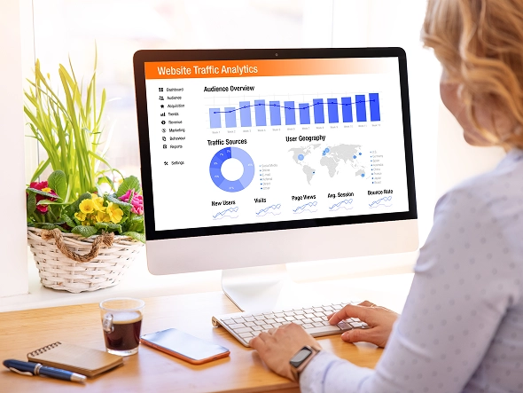 White label Wix site performance and enhancements — professional analyzing website performance graphs on desktop for optimization and improvements